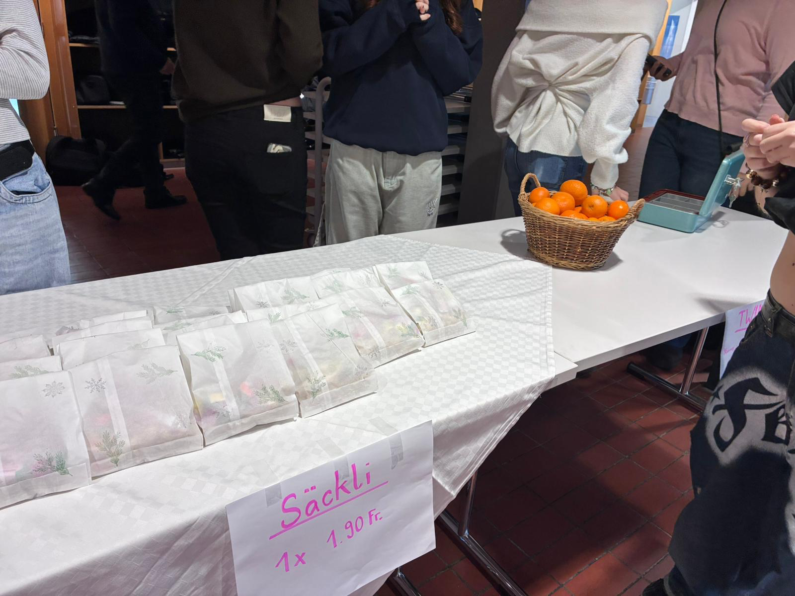 A group of people standing next to a table with bags of food

AI-generated content may be incorrect.